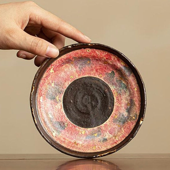 red ceramic and porcelain tea cup saucer and coaster