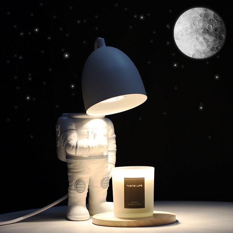 Astronaut Adjustable Heat Candle Warmer Lamp with Timer. Unique space-themed design with adjustable heat for even candle melting. Safe, smoke-free.