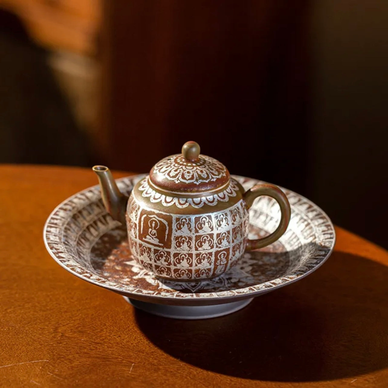 Traditional Chinese Buddha Ceramics Tea Pot. A beautifully crafted ceramic tea pot featuring a Buddha design, perfect for a calming tea experience with a touch of traditional Chinese artistry.