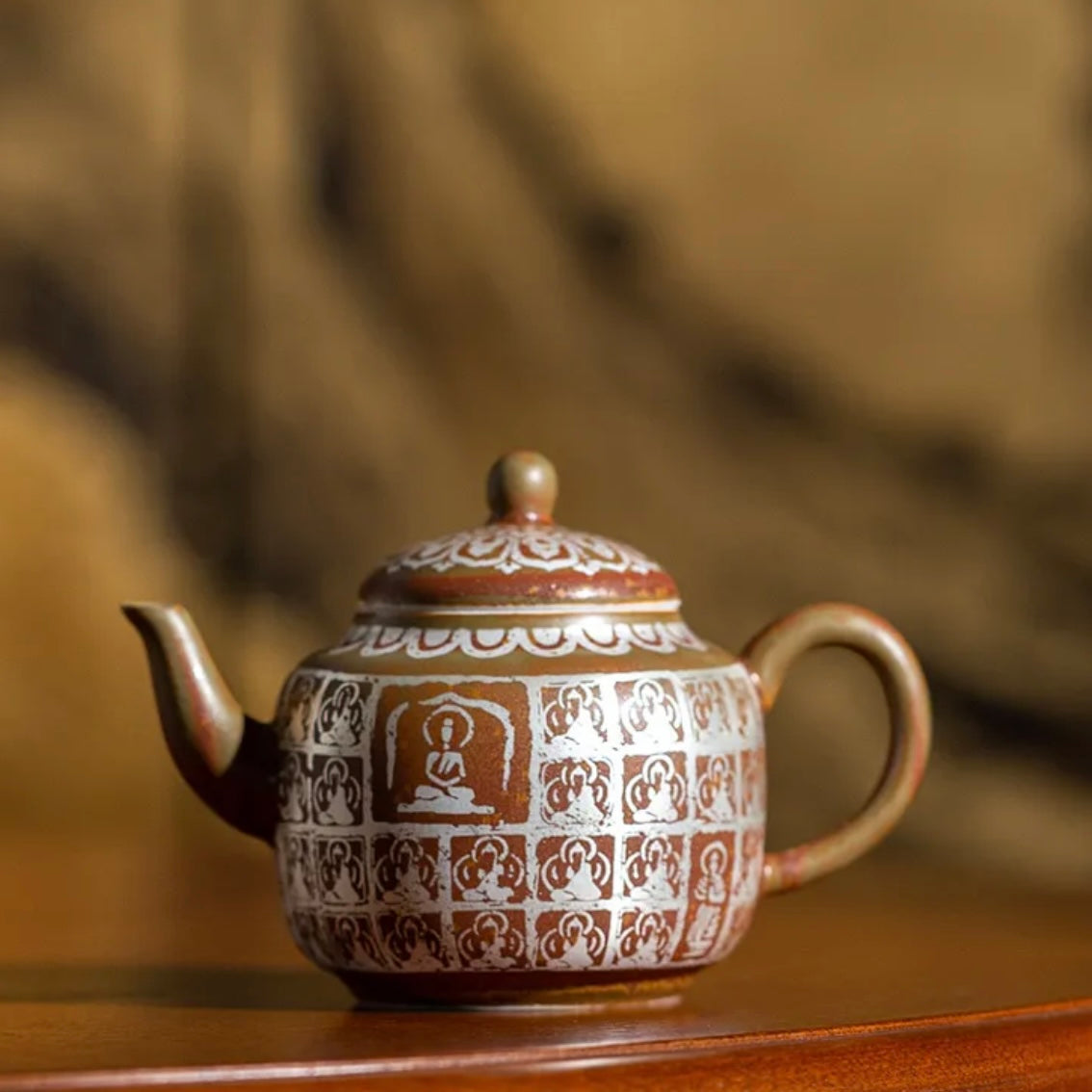 Traditional Chinese Buddha Ceramics Tea Pot. A beautifully crafted ceramic tea pot featuring a Buddha design, perfect for a calming tea experience with a touch of traditional Chinese artistry.