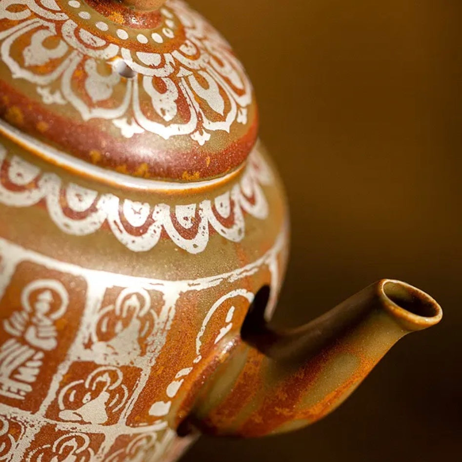 Traditional Chinese Buddha Ceramics Tea Pot. A beautifully crafted ceramic tea pot featuring a Buddha design, perfect for a calming tea experience with a touch of traditional Chinese artistry.