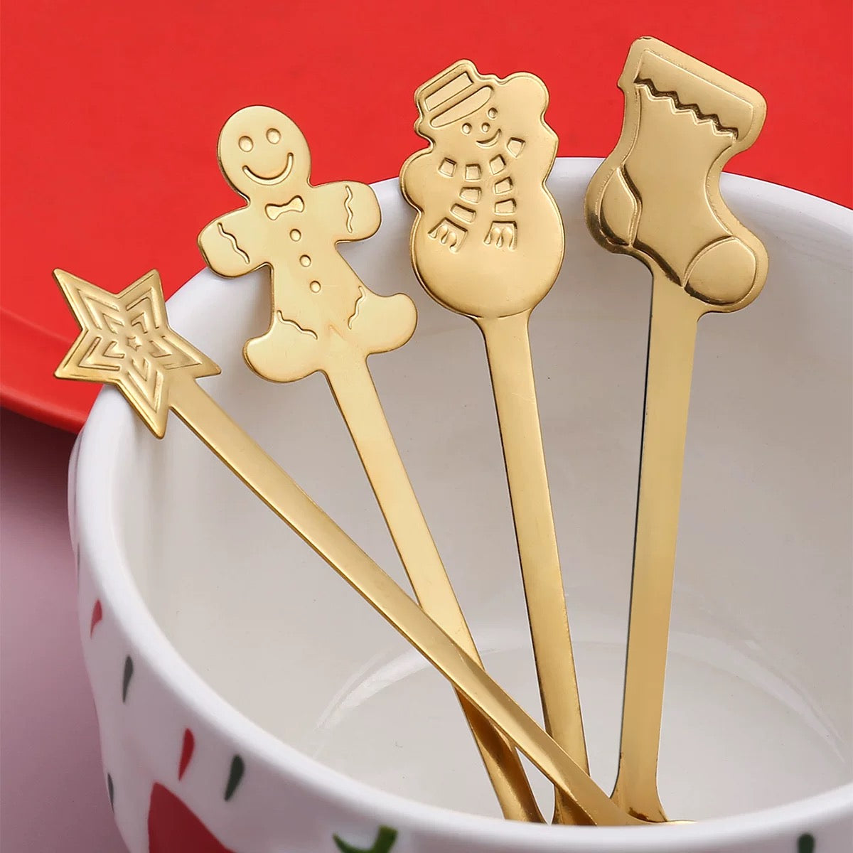 Christmas 4 Pieces Spoons Set. A festive set of four spoons designed with Christmas-themed accents, perfect for holiday meals and seasonal gatherings.