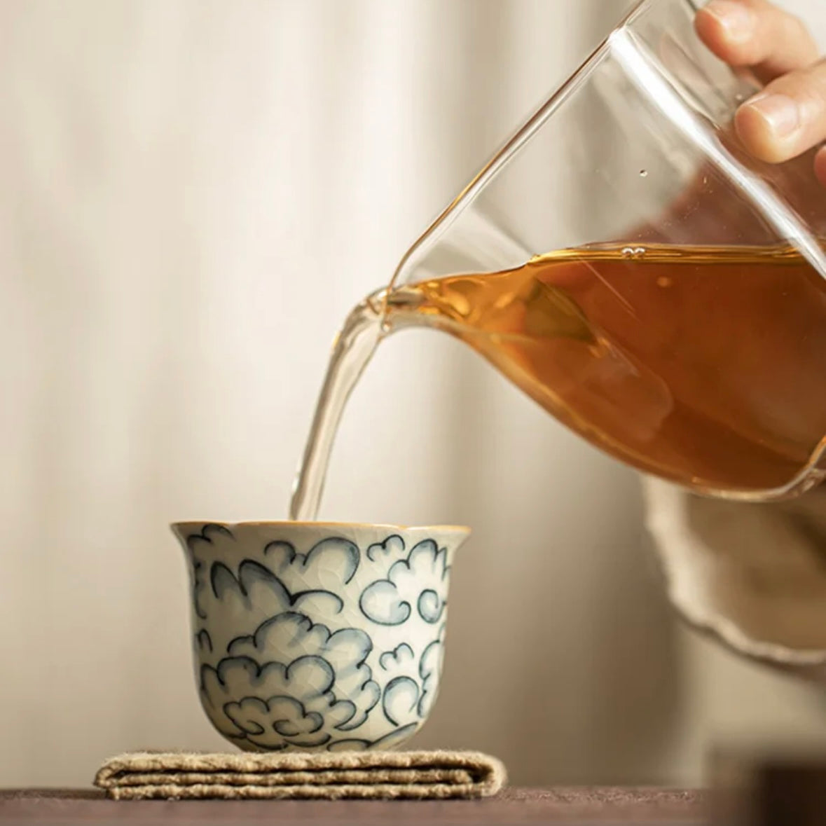 Cloud Pattern Tea Cup, pouring tea into the cup, Serene Ceramic Teaware