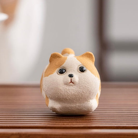 Handcrafted Corgi dog tea pet made from Yixing purple clay, ideal for tea ceremonies and traditional teaware collections.