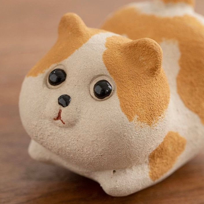 Handcrafted Corgi dog tea pet made from Yixing purple clay, ideal for tea ceremonies and traditional teaware collections.