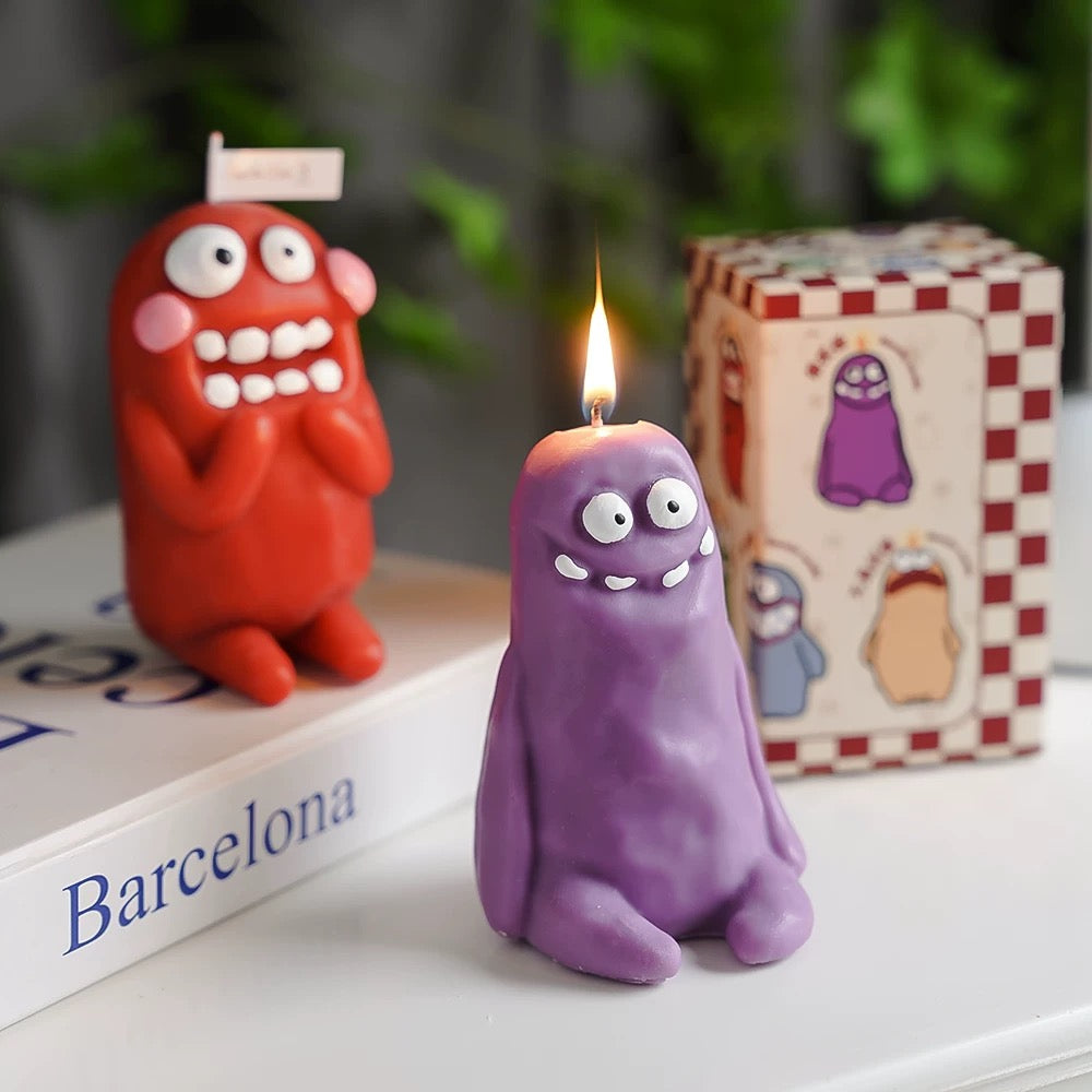 red and purple Cute-Ugly Doll Style Scented Candle Collection, Quirky & Colorful Decor