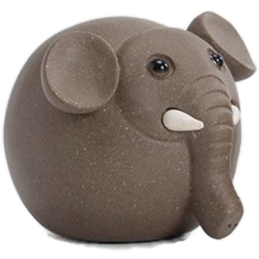 Elephant tea pet made from Yixing purple clay, featuring intricate craftsmanship and a symbolic design for traditional tea ceremonies.