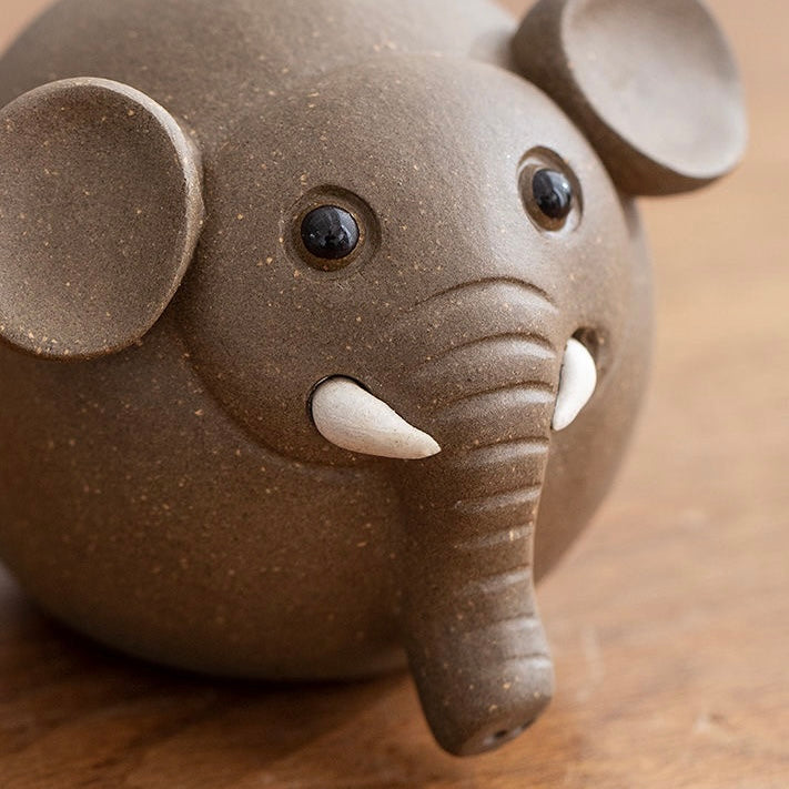 Elephant tea pet made from Yixing purple clay, featuring intricate craftsmanship and a symbolic design for traditional tea ceremonies.