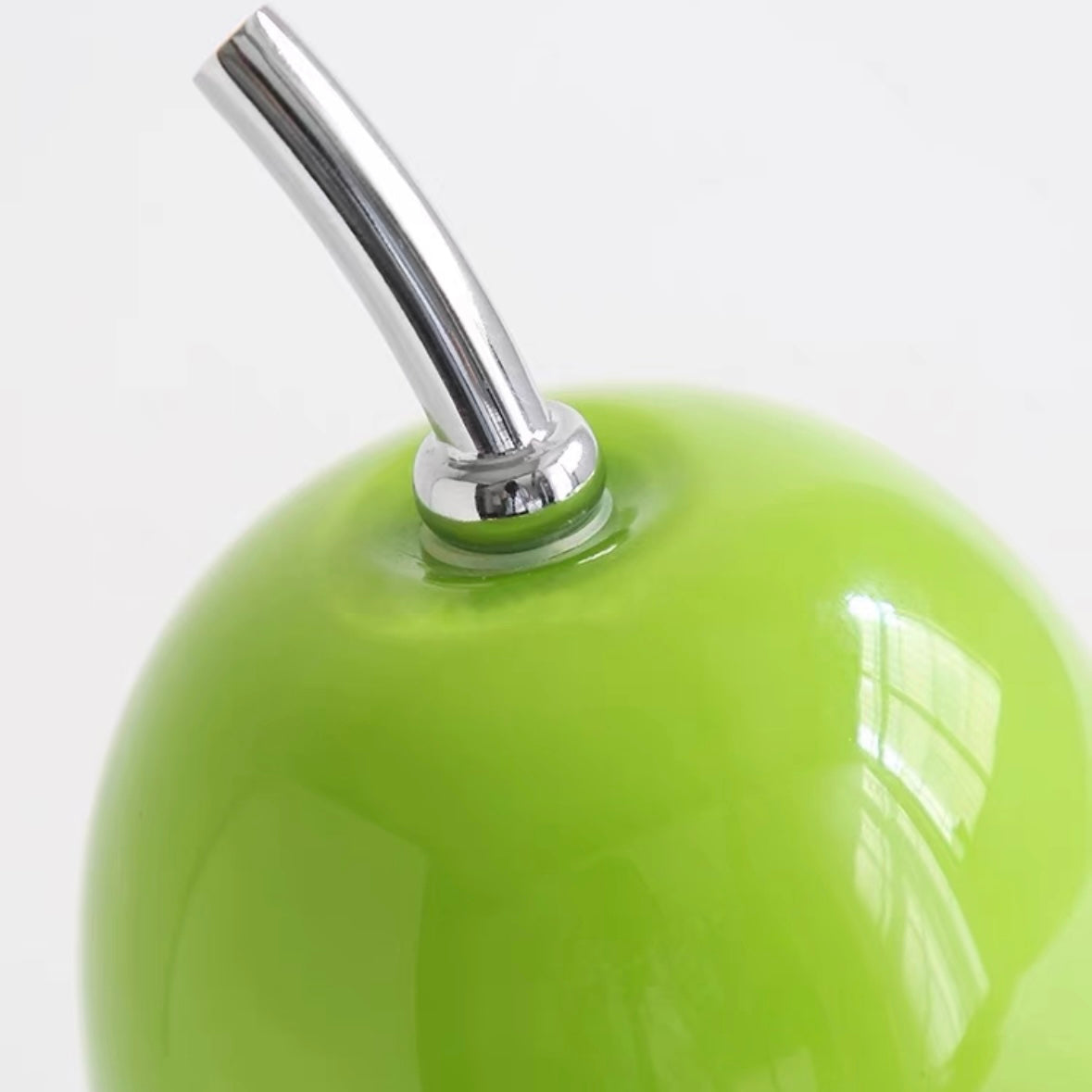 Green pear-shaped cordless rechargeable glass table lamp with sleek and modern design, ideal for portable lighting in home or outdoor settings.