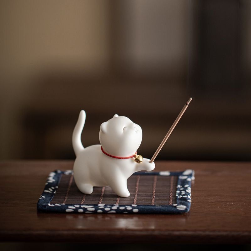 Kitten-shaped ceramic incense holder with an adorable design, ideal for home decor and relaxation rituals.