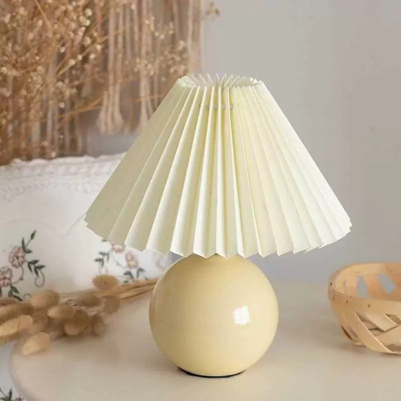 Light Yellow Porcelain Table Lamp. A soft yellow porcelain table lamp with a stylish design, perfect for enhancing the ambiance of your home.