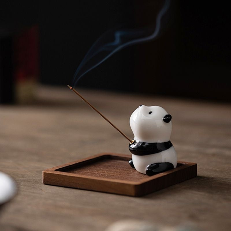 Panda-shaped ceramic incense holder featuring a playful design, ideal for home decor and meditation rituals.