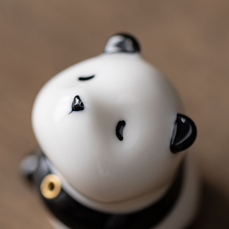 Panda-shaped ceramic incense holder featuring a playful design, ideal for home decor and meditation rituals.