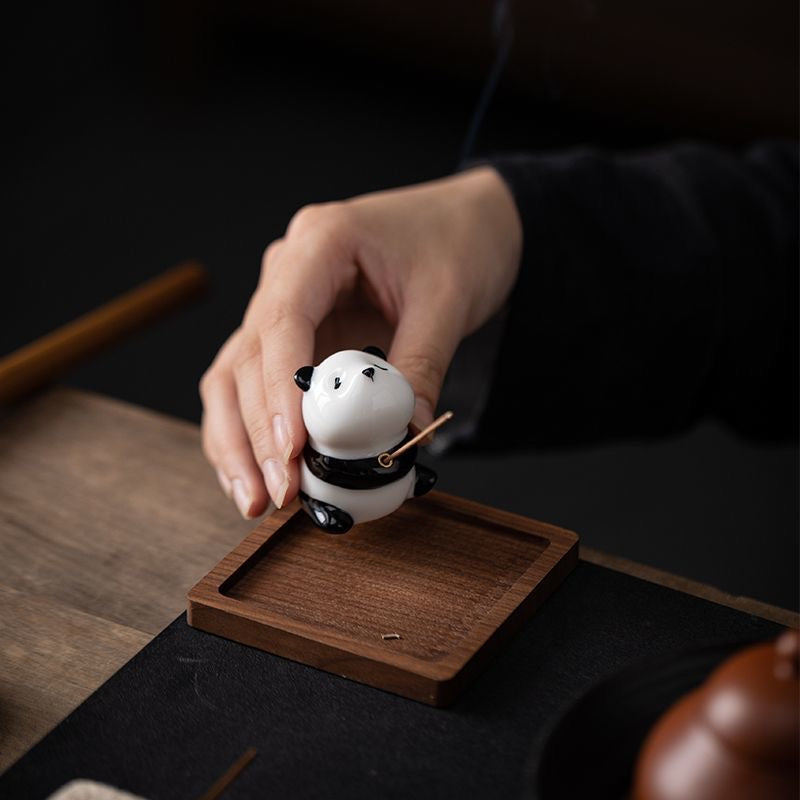 Panda-shaped ceramic incense holder featuring a playful design, ideal for home decor and meditation rituals.