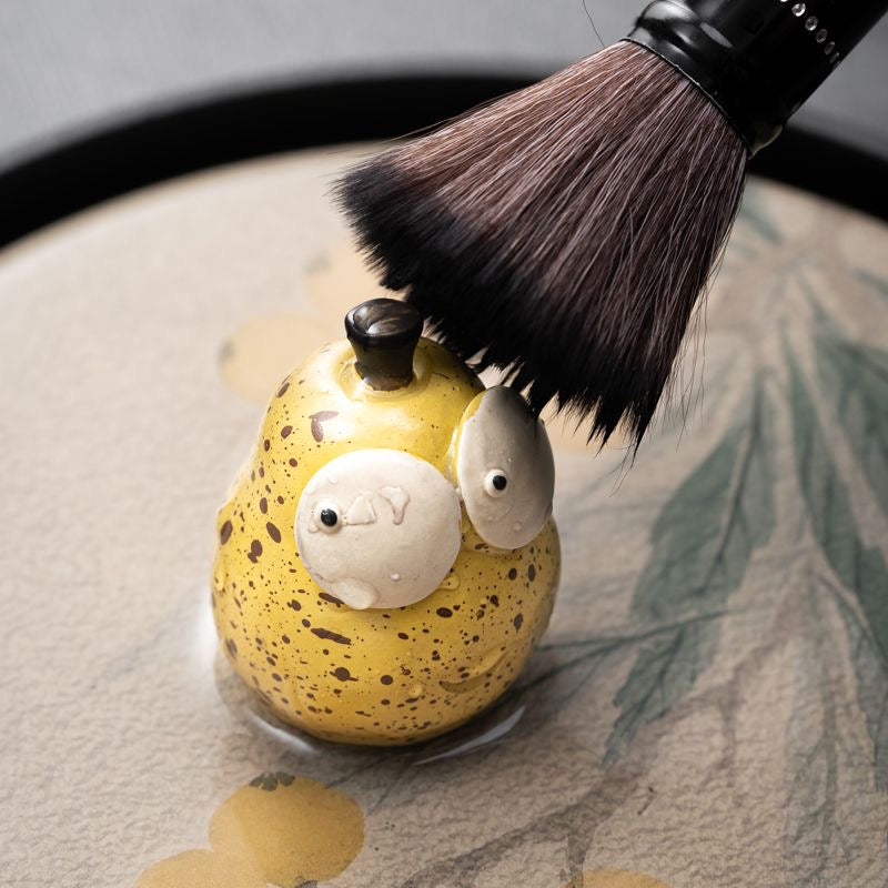 Pear Yixing Tea Pet. A beautifully crafted pear-shaped Yixing tea pet, perfect for enhancing your tea ceremony and bringing harmony to your tea rituals.
