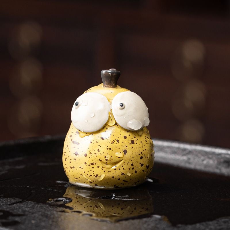 Pear Yixing Tea Pet. A beautifully crafted pear-shaped Yixing tea pet, perfect for enhancing your tea ceremony and bringing harmony to your tea rituals.