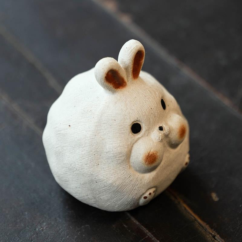 Rabbit Yixing Purple Clay Tea Pet. A cute rabbit-shaped Yixing tea pet, crafted from purple clay, adding a touch of luck and elegance to your tea experience.