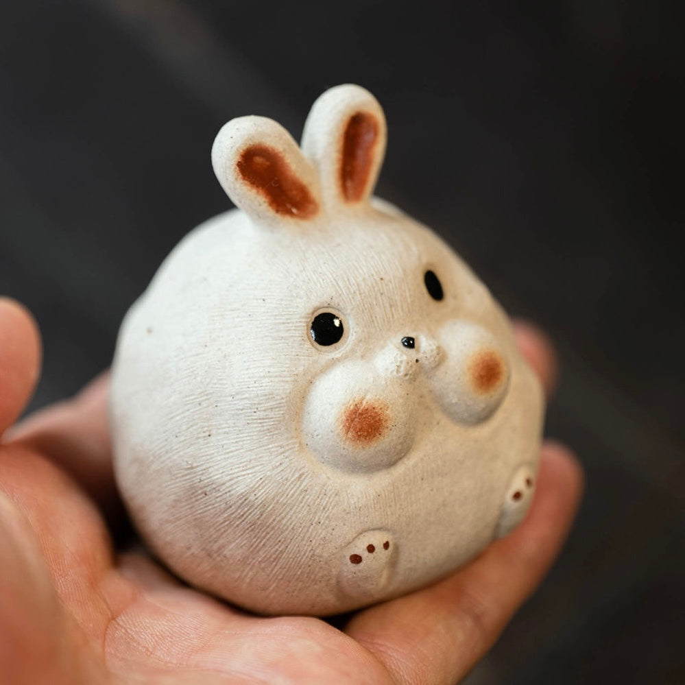 Rabbit Yixing Purple Clay Tea Pet. A cute rabbit-shaped Yixing tea pet, crafted from purple clay, adding a touch of luck and elegance to your tea experience.