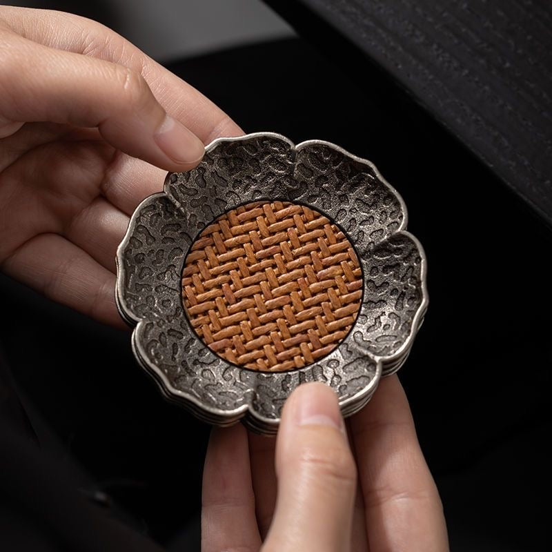 Rattan and Alloy Coaster. A stylish coaster made from durable rattan and alloy, offering both functionality and modern design to protect your furniture.
