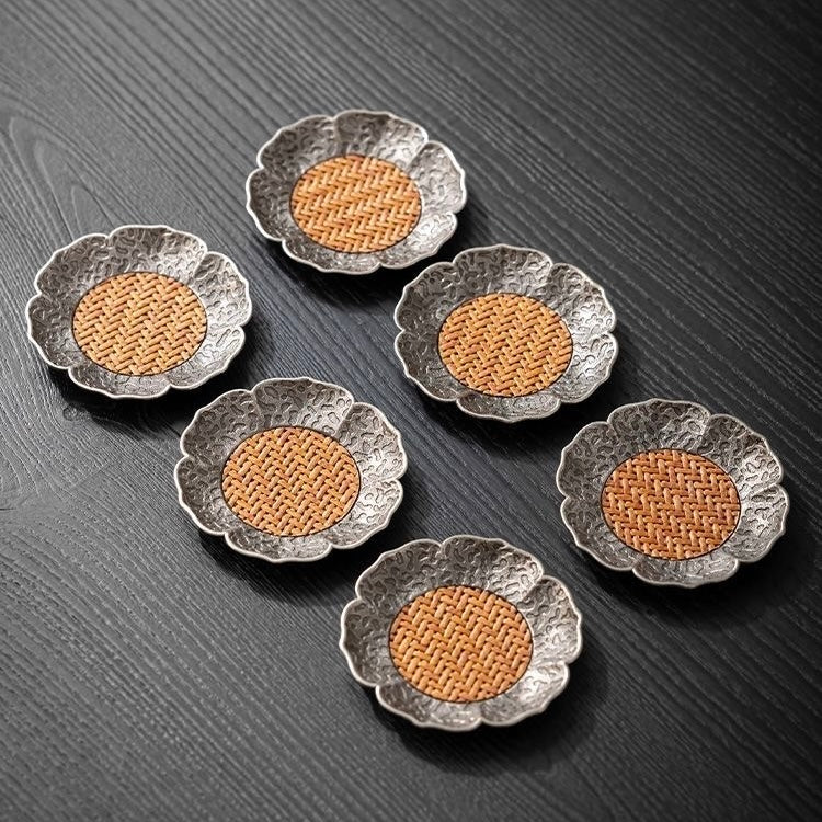 Rattan and Alloy Coaster. A stylish coaster made from durable rattan and alloy, offering both functionality and modern design to protect your furniture.