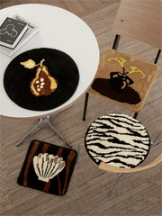 Set of 4 tufted rug and chair cushions in assorted styles, combining soft texture and versatile decor functionality.