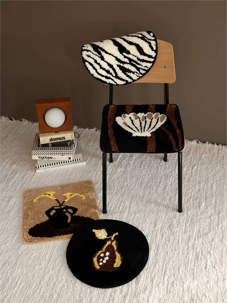 Set of 4 tufted rug and chair cushions in assorted styles, combining soft texture and versatile decor functionality.