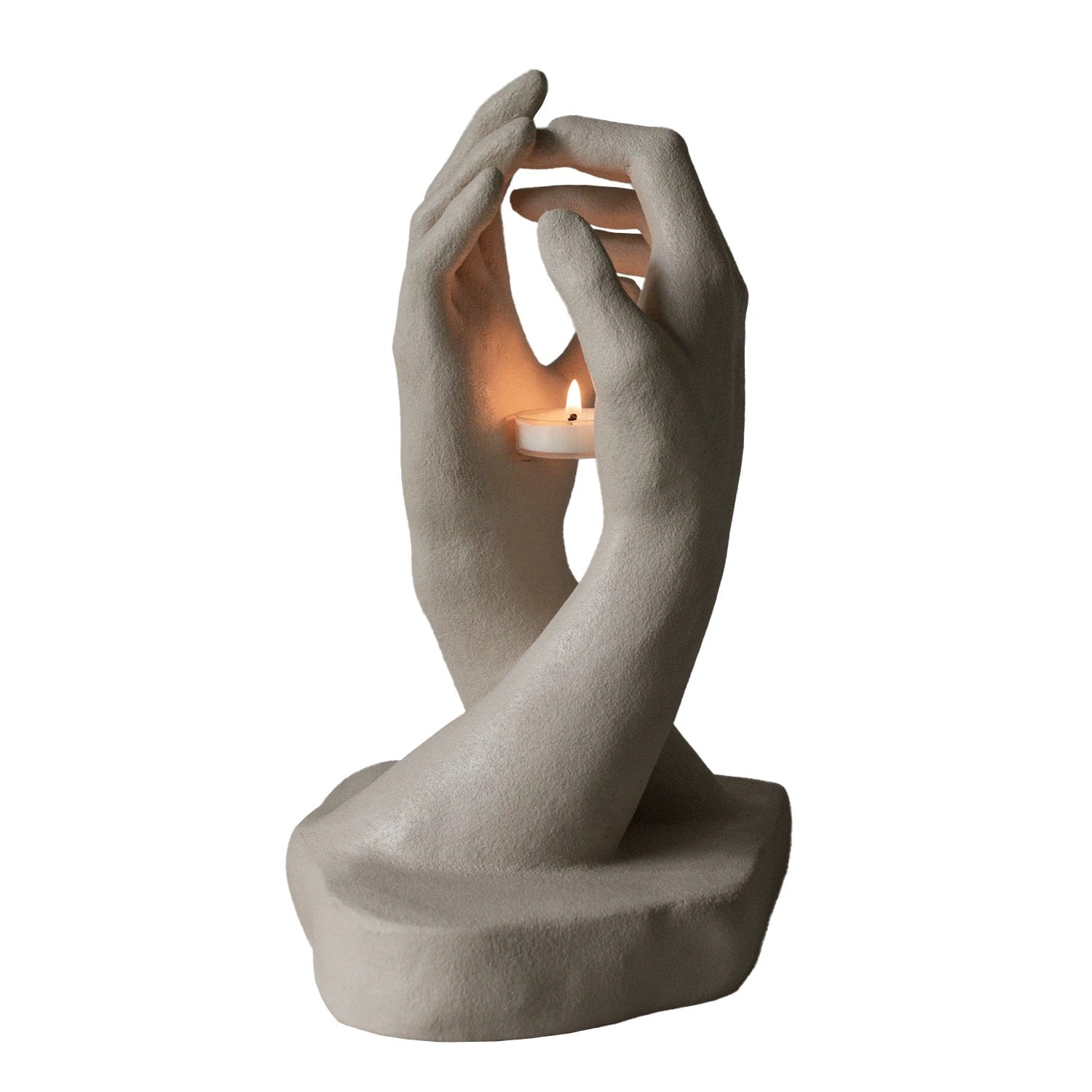 White Artistic High-end Candle Holder. A high-end candle holder with two crossed hands forming a stylish and artistic design, holding a candle in the center for an elegant home decor accent.