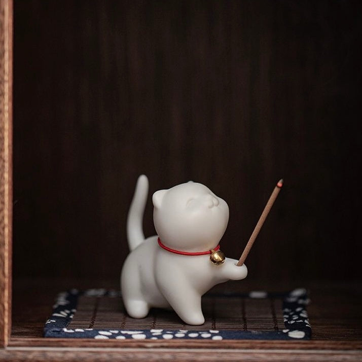 cat-shaped ceramic incense holder with an adorable design, ideal for home decor and relaxation rituals.