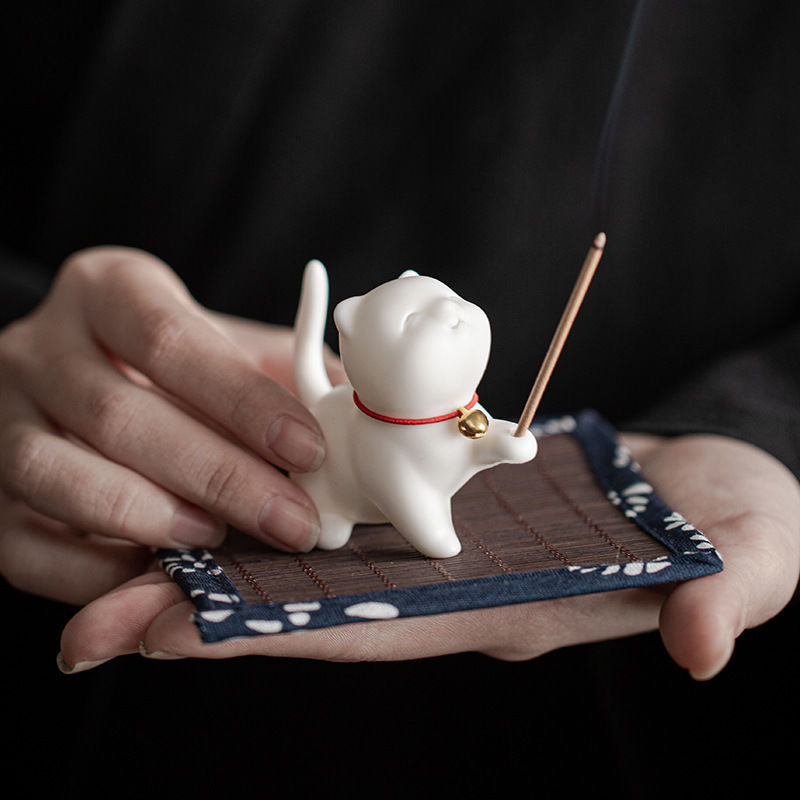 cat-shaped ceramic incense holder with an adorable design, ideal for home decor and relaxation rituals.