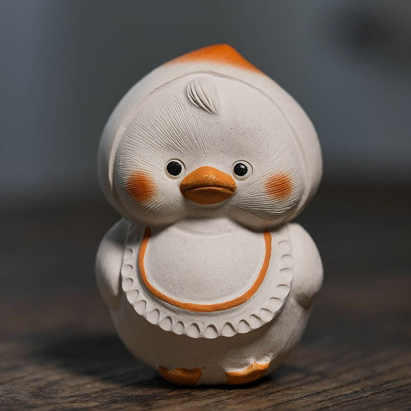 Handcrafted duck tea pet made from Yixing purple clay, blending traditional craftsmanship with charming design for tea ceremonies.