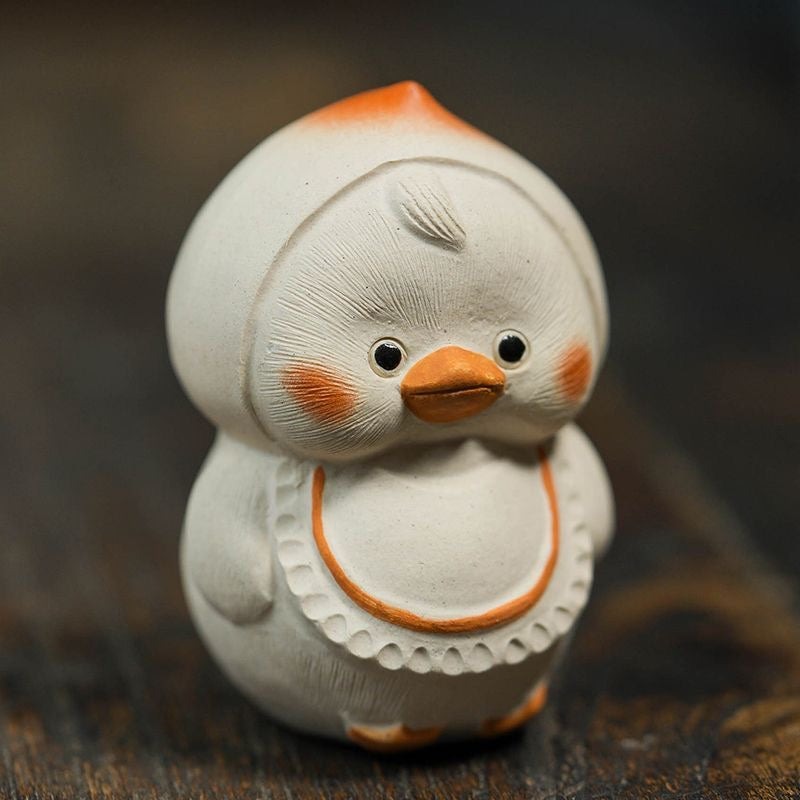 Handcrafted duck tea pet made from Yixing purple clay, blending traditional craftsmanship with charming design for tea ceremonies.