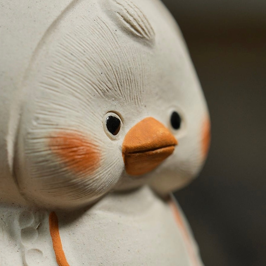 Handcrafted duck tea pet made from Yixing purple clay, blending traditional craftsmanship with charming design for tea ceremonies.